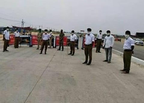In this image shared by a Twitter user, the Rashtriya Sewa Sangh men can be seen with masked faces at a checkpoint near Hyderabad. (Photo | Twitter)