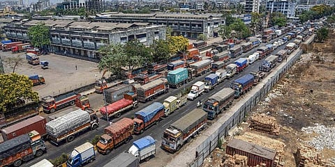 Trucks stand parked outside the closed APMC vegetable market during the nationwide lockdown to curb the spread of coronavirus in Navi Mumbai. (Photo | PTI)