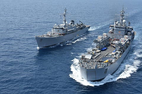 An Indian Navy training ship being replenished at sea