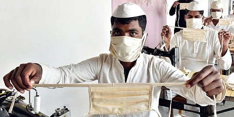 Prisoners wear protective masks as they stitching face masks inside Netaji Subhash Chandra Bose central jail, in Jabalpur. (File photo| ANI)
