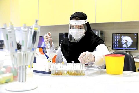 A scientist works in a lab on coronavirus testing kits. (Photo | AP)