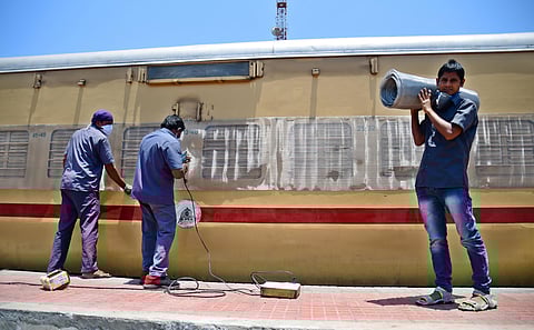 Bengaluru Workers converting railway boggies into isolation wards at Kranthiveera sangolli rayanna railway station on Monday. (Photo | Shriram BN, EPS)