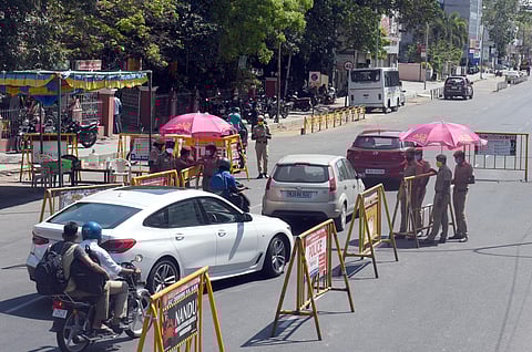 Police checking the vehicles to avoid unnecessary travel near Spencers signal at Mount Road during lockdown. (Photo | Martin Louis, EPS)