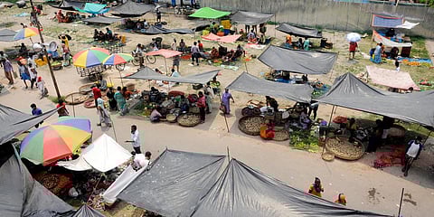People arrive at a makeshift market at KIT Park to purchase daily essentials during the second phase of COVID-19 lockdown in Kolkata. (Photo| ANI)