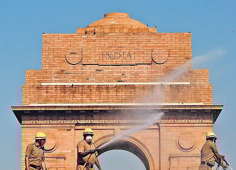 Firefighters spray disinfectants near India Gate, during the nationwide lockdown in New Delhi on Friday | Shekhar Yadav