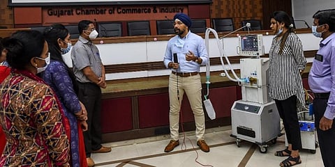 An doctor interacts with other medical professionals as he demonstrates the working of a ventilator at a workshop during a government-imposed nationwide lockdown at the Gujarat Chambers of Commerce and Industries in Ahmedabad. (Photo | AFP)