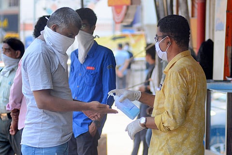 Sunday witnessed a rush in the mobile repairing shops in Kozhikode. Many shops demanded customers to use hand sanitizers before entering and kepp distance from one another while in the shops to maintain the Social Distance in the COVID-19 lockdown. (Photo