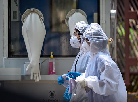 Medics walk past a new swab testing cabin at Podar hospital in Worli during a nationwide lockdown in the wake of coronavirus pandemic in Mumbai Sunday April 19 2020. (Photo | PTI)