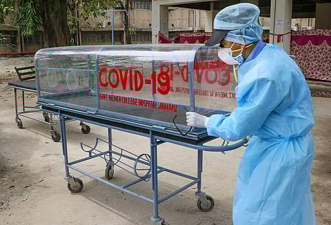 A medic pushes a stretcher outside Government Medical College during a nationwide lockdown in the wake of coronavirus pandemic in Jammu Monday April 20 2020. (Photo | PTI)