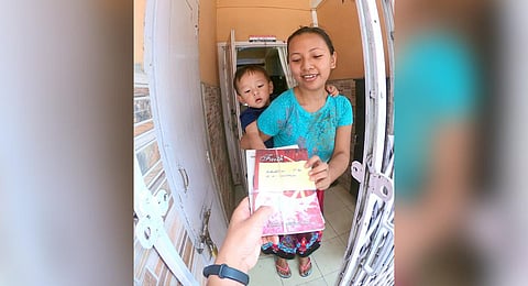 The NGO, Young Mizo Association (YMA), is reaching out to people at their doorsteps with books. (Photo | EPS)