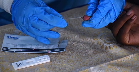 A healthcare worker collecting blood sample from a person to test it using rapid testing kit (Photo | EPS, A Raja Chidambaram)