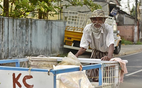 68-year-old Arumugan continues to battle odds, including Covid-19 and age-old ailments, to work as a waste collector. (Photo | Albin Mathew, EPS)