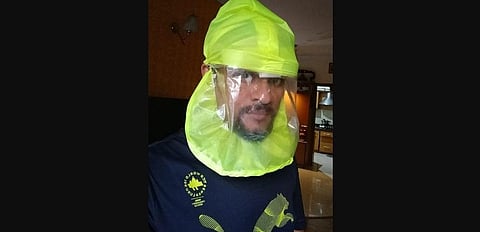 The respirator consists of a visor that has a tube at the back which connects it to a belt.