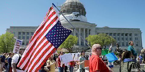 People gather outside the Missouri Capitol to protest stay-at-home orders put into place due to the COVID-19 outbreak. (Photo| AP)