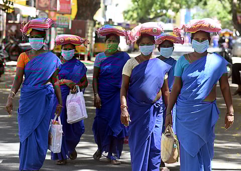Conservancy workers returning home after receiving ration. (Photo | Martin Loius, EPS)