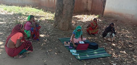 A 'Bank Sakhi' serving villagers (Photo | EPS)