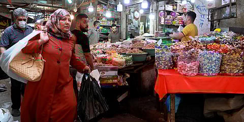 People shop in preparation for the Muslim fasting month of Ramadan, in Baghdad. (Photo| AP)