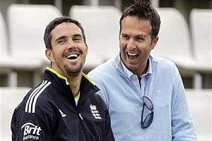 England's Kevin Pietersen, left, laughs with former England captain Michael Vaughan. AP