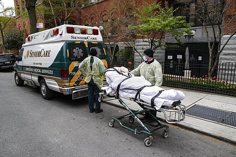 In this April 17, 2020 file photo, a patient is wheeled out of Cobble Hill Health Center by emergency medical workers in the Brooklyn borough of New York. (Photo | AP)