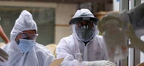 Health workers collect swab samples from people for COVID -19 tests in New Delhi. (Photo | Shekhar Yadav, EPS)