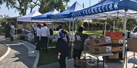 Sewa International volunteers distribute relief material and aid for coronavirus-hit people in US. (Photo| Twitter)