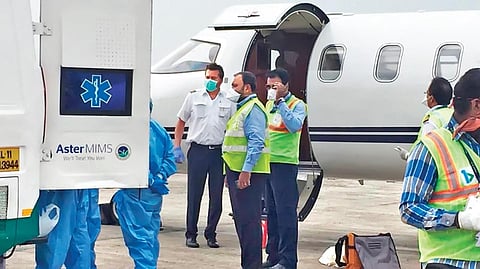 IT professional Prasad Das being shifted from the air ambulance to a special ambulance at Karipur airport on Friday | EXPRESS