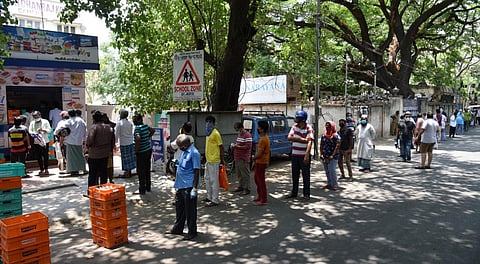 People que to buy milk at Aavin mail parlour before the total lockdown at Vepery, in Chennai on Saturday. (Photo | R Sathish Babu/EPS)