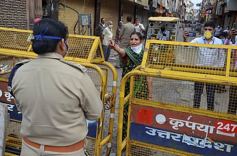 Police stop locals from moving out of a quarantine zone during the nationwide lockdown to curb the spread of coronavirus in Mathura Saturday April 25 2020. (Photo | PTI)