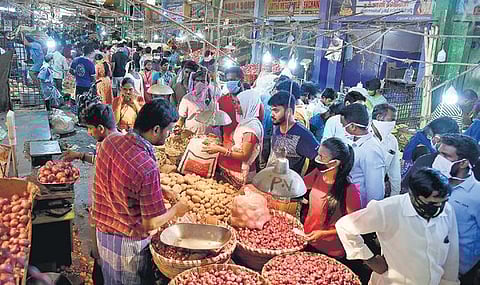 Crowded Koyambedu vegetable market on Saturday when residents thronged there after the government announced four-day intense lockdown | Martin Louis