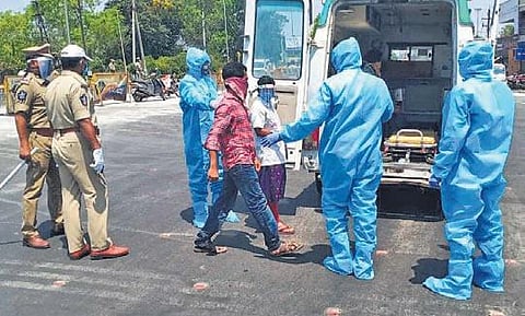 Lockdown violators being shifted to a quarantine centre in an ambulance, in Vijayawada on Monday | EXPRESS
