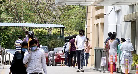 People walk inside the premises of Max Hospital at Patparganj during the nationwide lockdown to curb the spread of coronavirus in New Delhi on Tuesday April 28 2020. (Photo | Parveen Negi/EPS)