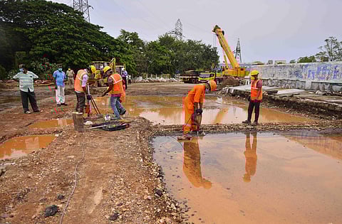 Railway workers making arrangements for demolishing the damaged Elephant Gate rail-over-bridge in the city on Sunday | Debadatta Mallick