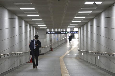 A man wearing a face mask to help protect against the spread of the new coronavirus walks on the underpass in Seoul, South Korea, Thursday, April 2, 2020. (Photo | AP)