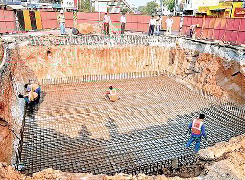 GHMC workers taking up SRDP construction work amid the Covid-19 lockdown in Hyderabad on Thursday