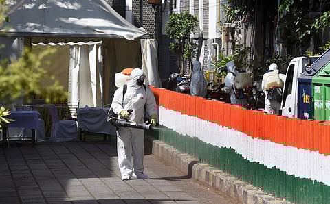 A health worker sanitises an area near Nizamuddin mosque after people who attended the religious congregation at Tabligh-e-Jamaats Markaz tested postive for COVID-19 in New Delhi. (Photo | Parveen Negi, EPS)