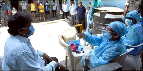 Dharavi Medical Practitioners Association practice COVID-19 screening for residents at Dharavi in Mumbai. (File photo| ANI)
