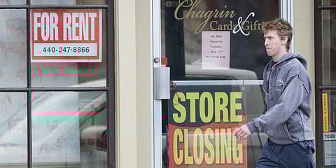A man walks past a closed business, Wednesday, April 29, 2020, in Chagrin Falls, Ohio. (Photo | AP)