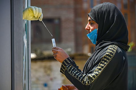 A woman gets herself tested for coronavirus. (Photo| PTI)