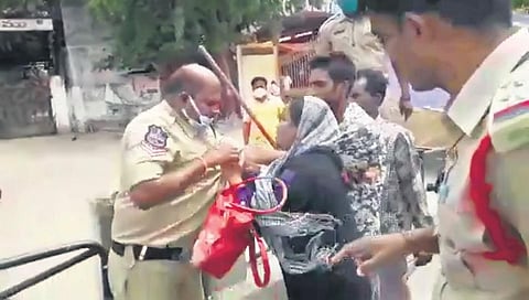 A woman and her son attack a policeman in Lalapet on Friday | Express