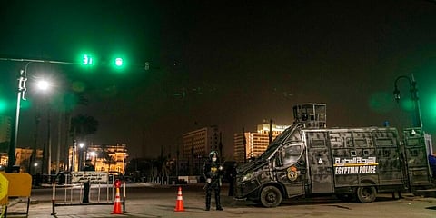 Egyptian security forces cordon off roads during curfew hours as prevention measures due to the coronavirus outbreak in Cairo. (Photo | AP)