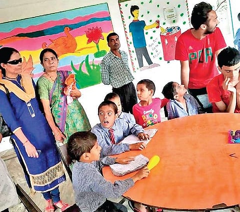 Kavita Bisht with the differently-abled children at the school in Ramnagar in Nainital district of Uttarakhand