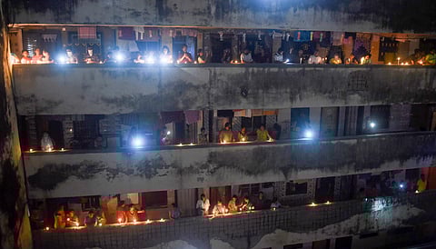 People light candles, lamps and flash mobile phones at a society to express the country's unity in fight against COVID-19, amid the nationwide lockdown. (PTI photo used for representational purposes))