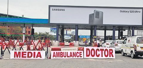 Signboards being placed for essential services at Delhi-Noida flyway. (Photo | Anil Shakya, EPS)