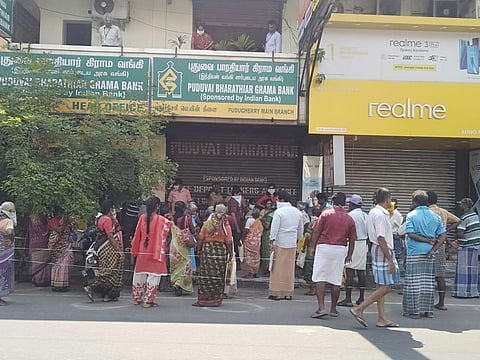 people have crowded in front of banks and ATMs on MG Road. (Photo | EPS)