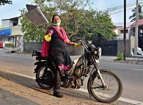 Ponni Selvarajan supplying newspapers in Coimbatore on Sunday. (Photo | U Rakesh Kumar/EPS)