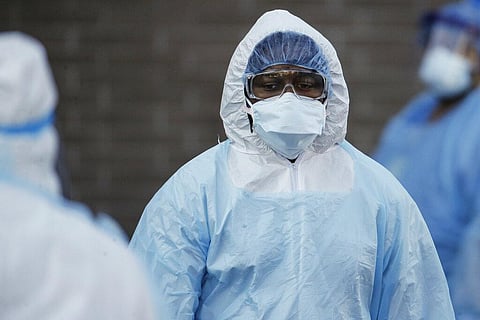 A medical worker wearing personal protective equipment n the Brooklyn borough of New York. (Photo | AP)