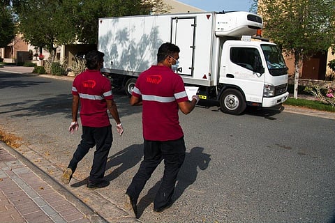 Deliverymen leave after dropping off alcohol at a home in Dubai, United Arab Emirates. (Photo| AP)