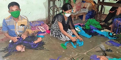 UGBS members making masks at the organisation’s office in Bargarh. (Photo | EPS)