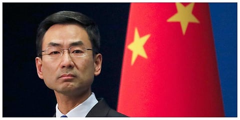 In this March 18, 2020, file photo, Chinese Foreign Ministry spokesman Geng Shuang listens to a question during a daily briefing at the Ministry of Foreign Affairs office in Beijing. (Photo | AP)