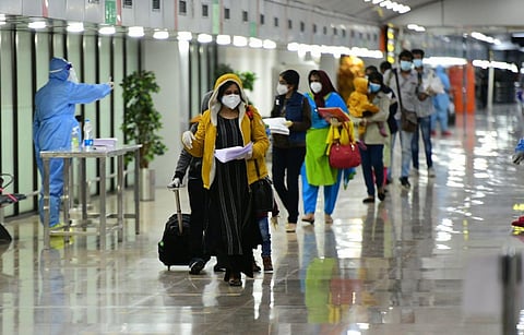 Passengers of the Doha-Thiruvananthapuram flight at Thiruvananthapuram International Airport. (Photo | By special arrangement)